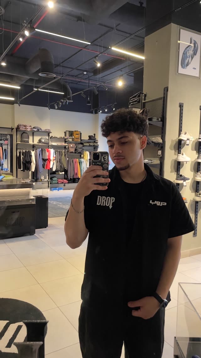 Ziad in the Drop The Shop store, wearing the team shirt
