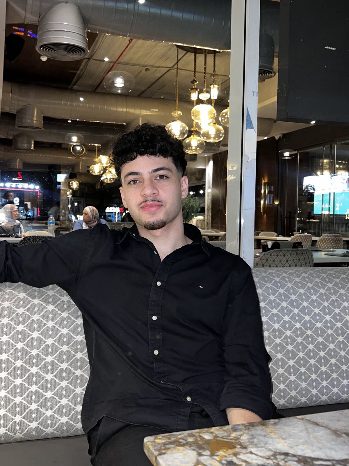Ziad at a restaurant table in the evening