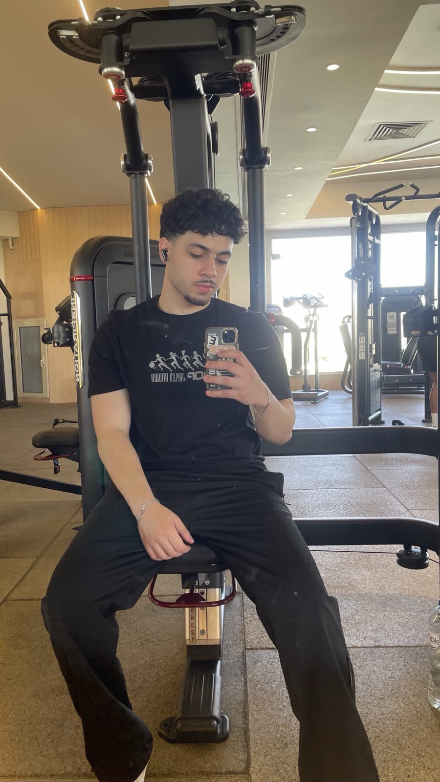 Ziad sitting on a machine at the gym